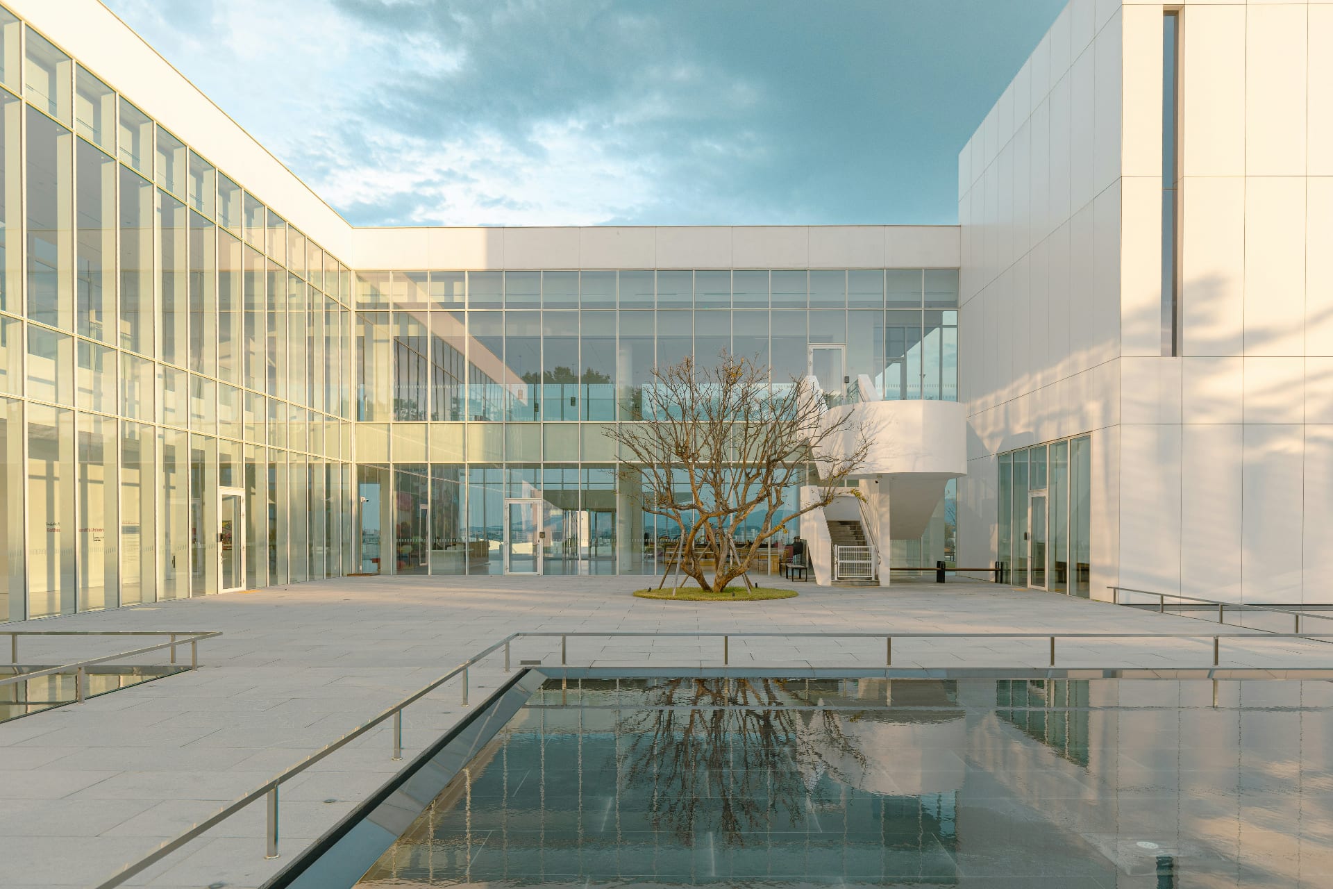 Modern office building at dusk, Tacit deployed across institutional and commercial portfolios